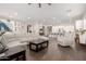 Spacious living room with a large white sectional sofa and an open floor plan at 12035 S 186Th Ave, Goodyear, AZ 85338