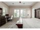 Serene bedroom with a large bed, lots of windows, and soft natural light for relaxation and comfort at 12035 S 186Th Ave, Goodyear, AZ 85338
