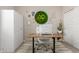 Home office featuring desk and storage cabinets, and eclectic decor at 12035 S 186Th Ave, Goodyear, AZ 85338