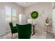 Home office featuring large window, two green chairs and decor at 12035 S 186Th Ave, Goodyear, AZ 85338