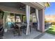 Covered patio featuring a table with 4 chairs, as well as couches at 12035 S 186Th Ave, Goodyear, AZ 85338