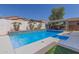 Sparkling pool with tiled accents and landscaped surroundings, offering a refreshing escape in a private backyard oasis at 12035 S 186Th Ave, Goodyear, AZ 85338
