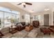 Bright living room with large windows, comfortable seating, and stylish decor at 14124 W Bent Tree S Cir, Litchfield Park, AZ 85340