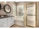 Bright main bathroom with double sinks, separate tub, and shower at 14124 W Bent Tree S Cir, Litchfield Park, AZ 85340