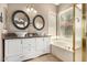 Spa-like main bathroom with double vanities, vessel sinks, and separate tub at 14124 W Bent Tree S Cir, Litchfield Park, AZ 85340