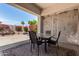 Outdoor patio area with dining table set and views of desert landscaping at 14124 W Bent Tree S Cir, Litchfield Park, AZ 85340