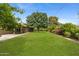 Enjoy this large backyard with an established lawn, mature shade trees and shrubbery at 143 E Winter Dr, Phoenix, AZ 85020