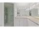 Beautiful bathroom with glass shower door, quartz countertops, white cabinets, and decorative mosaic at 143 E Winter Dr, Phoenix, AZ 85020