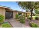 Inviting home exterior featuring a decorative entry door, lovely landscaping, and a well-manicured lawn at 143 E Winter Dr, Phoenix, AZ 85020