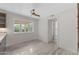 Bright kitchen area with tile floors, a ceiling fan, and lots of natural light from the window at 143 E Winter Dr, Phoenix, AZ 85020