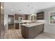 Stylish kitchen with custom cabinets, a central island, modern appliances, and ample counter space at 143 E Winter Dr, Phoenix, AZ 85020