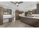 Spacious kitchen with an island, stainless steel appliances, ample cabinetry, and modern lighting at 143 E Winter Dr, Phoenix, AZ 85020