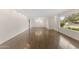 Open living space with hardwood floors, recessed lighting, and large picture windows providing natural light at 143 E Winter Dr, Phoenix, AZ 85020