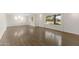 Spacious living room featuring gleaming hardwood floors, recessed lighting, and large windows for natural light at 143 E Winter Dr, Phoenix, AZ 85020