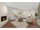 Inviting living room with a fireplace, neutral furniture, and an open floor plan at 143 E Winter Dr, Phoenix, AZ 85020