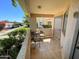 Private outdoor seating area on a covered balcony with tile flooring and storage at 145 N 74Th St # 125, Mesa, AZ 85207