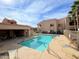 Sparkling community pool with lounge chairs and a covered seating area in a well-maintained complex at 145 N 74Th St # 125, Mesa, AZ 85207