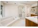 Large primary bathroom featuring walk-in shower and separate soaking tub at 1562 W Las Palmaritas Dr, Phoenix, AZ 85021