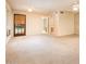 Spacious bedroom with carpet, ceiling fan, exterior access, and an ensuite bathroom at 1562 W Las Palmaritas Dr, Phoenix, AZ 85021