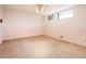 Bedroom with a window and neutral carpet at 1562 W Las Palmaritas Dr, Phoenix, AZ 85021