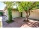 Private courtyard with brickwork and greenery leading to house, ideal for relaxation or entertaining at 1562 W Las Palmaritas Dr, Phoenix, AZ 85021