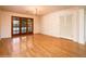 Bright dining area features hardwood floors, chandelier, and access to backyard at 1562 W Las Palmaritas Dr, Phoenix, AZ 85021