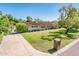 Beautiful single story home with a lush front lawn, mature shade trees, and a brick mailbox at 1562 W Las Palmaritas Dr, Phoenix, AZ 85021