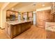 Spacious kitchen with a large island, stainless steel appliances and hardwood floors throughout at 1562 W Las Palmaritas Dr, Phoenix, AZ 85021