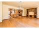 Spacious open-concept living room showcases hardwood floors, custom cabinetry, and flow to the adjacent kitchen at 1562 W Las Palmaritas Dr, Phoenix, AZ 85021