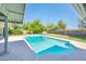 Beautiful pool with a pristine concrete deck and surrounding privacy fence, perfect for relaxation and entertaining at 1562 W Las Palmaritas Dr, Phoenix, AZ 85021