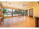 Sunroom with hardwood floors and views of the pool, yard and outdoor living spaces at 1562 W Las Palmaritas Dr, Phoenix, AZ 85021