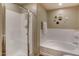 Bright bathroom featuring a separate shower and tub with neutral color walls at 16525 E Avenue Of The Fountain -- # 113, Fountain Hills, AZ 85268
