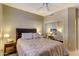 Comfortable bedroom with large closet mirror, ceiling fan and bedside tables at 16525 E Avenue Of The Fountain -- # 113, Fountain Hills, AZ 85268