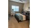 Bedroom featuring a queen-size bed and a window with blinds, creating a calm and inviting space at 16525 E Avenue Of The Fountain -- # 113, Fountain Hills, AZ 85268