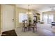 Cozy dining area featuring a round table, a chandelier, and easy access to both the kitchen and the living room at 16525 E Avenue Of The Fountain -- # 113, Fountain Hills, AZ 85268