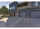 Home exterior featuring attached garages, stone details, and wide driveway at 16525 E Avenue Of The Fountain -- # 113, Fountain Hills, AZ 85268