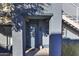 Entryway featuring a covered porch, a modern-style front door with decorative wreath, and desert-style landscaping at 16525 E Avenue Of The Fountain -- # 113, Fountain Hills, AZ 85268