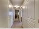 Well lit hallway with views to other rooms and tiled flooring at 16525 E Avenue Of The Fountain -- # 113, Fountain Hills, AZ 85268