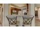This cozy kitchen has nice wood cabinets, and a breakfast bar with two bar stools at 16525 E Avenue Of The Fountain -- # 113, Fountain Hills, AZ 85268