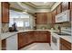 This kitchen features plenty of cabinet space and views into the living area at 16525 E Avenue Of The Fountain -- # 113, Fountain Hills, AZ 85268