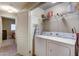 Functional laundry room with washer, dryer, storage shelf, and an ironing board at 16525 E Avenue Of The Fountain -- # 113, Fountain Hills, AZ 85268
