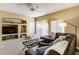 The inviting living room offers a cozy sectional sofa, a stylish coffee table, and built-in shelving for decor and entertainment at 16525 E Avenue Of The Fountain -- # 113, Fountain Hills, AZ 85268