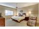 Spacious main bedroom with a ceiling fan, a comfortable bed, and lots of space at 16525 E Avenue Of The Fountain -- # 113, Fountain Hills, AZ 85268