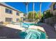 Community pool with blue trimmed pool, blue rails and whirlpool with patterned tiles at 16525 E Avenue Of The Fountain -- # 113, Fountain Hills, AZ 85268