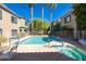 Community pool with palm trees, lounge chairs and a whirlpool at 16525 E Avenue Of The Fountain -- # 113, Fountain Hills, AZ 85268