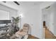 Bright bedroom with a cozy chair, gaming setup and baby gate, a comfortable and secure space at 16887 W Belleview St, Goodyear, AZ 85338