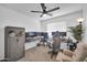 Well-lit bedroom with multiple monitors and gaming setup, creating an ideal space for entertainment and productivity at 16887 W Belleview St, Goodyear, AZ 85338