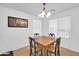 Cozy dining room featuring a wooden table with chairs and natural light from the windows at 16887 W Belleview St, Goodyear, AZ 85338