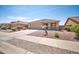 Inviting single-story home with a two-car garage and desert landscaping, offering curb appeal and easy maintenance at 16887 W Belleview St, Goodyear, AZ 85338