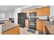 Functional kitchen with ample cabinet space and appliances, offering an efficient cooking space at 16887 W Belleview St, Goodyear, AZ 85338